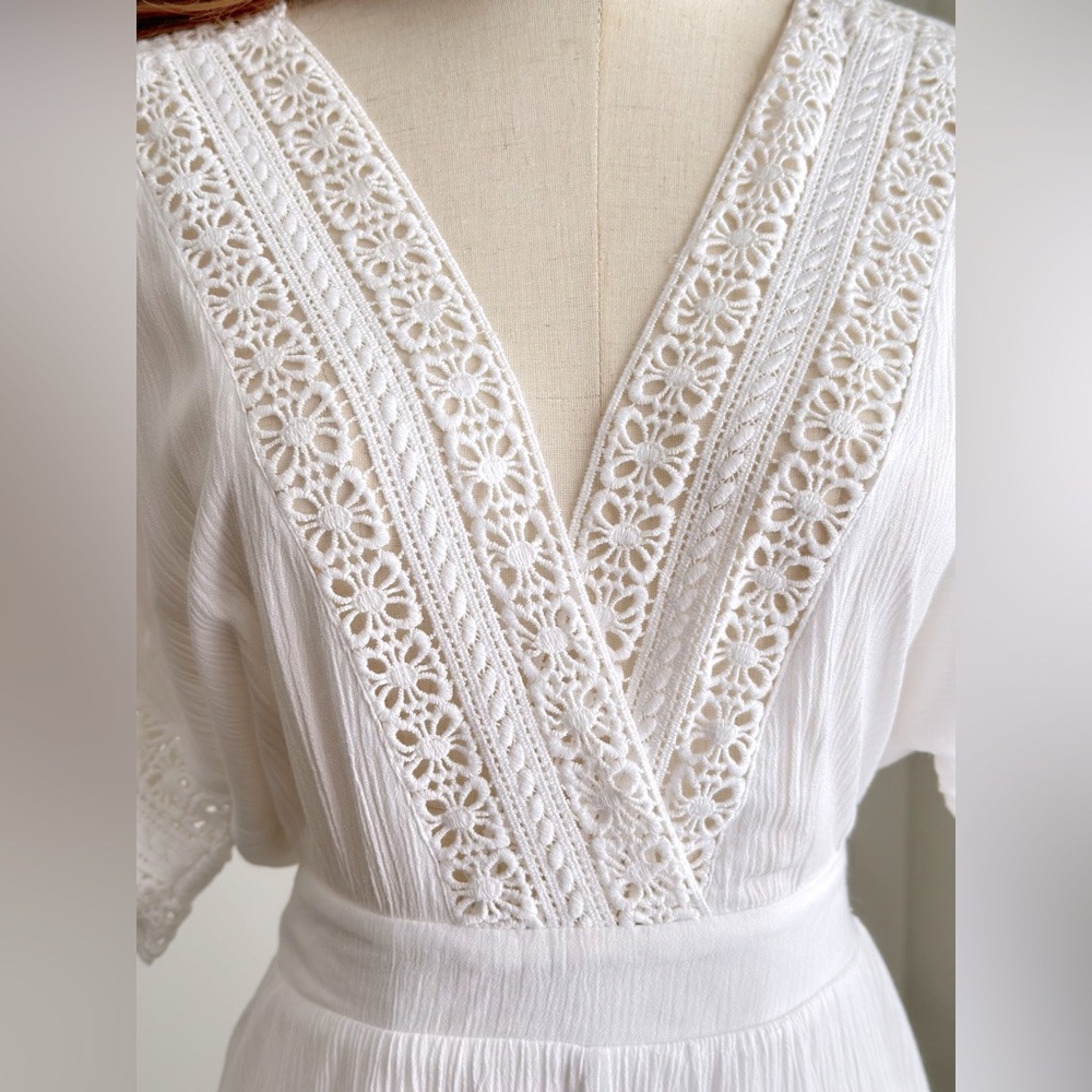 White gauze and crochet lace romper